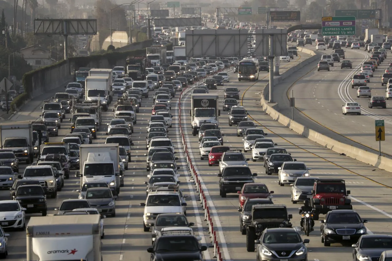 Los Angeles I-5 and 101 freeway interchange with overhead direction signs and heavy traffic